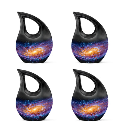 Charcoal Black Galaxy Cremation Urn lifestyle display on memorial shelf - faith-inspired cross-drop urn with galaxy pattern - 10 inch aluminum urn for cremated remains