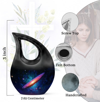 Deep Black Galaxy Cremation Urn back view with polished surface - sacred cross merged with galaxy motif on metal - mini keepsake memorial for portion of cremation ashes