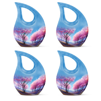 Azure Cherry Blossom Cremation Urn lifestyle display on memorial shelf - sacred cross merged with cherry blossom motif on metal - 10 inch aluminum urn for cremated remains