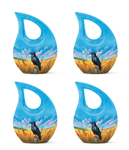 Misty Blue Crow Cremation Urn lifestyle display on memorial shelf - cross and crow combined in spiritual memorial design - 10 inch aluminum urn for cremated remains