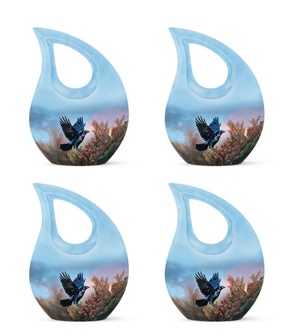 Royal Blue Crow Cremation Urn lifestyle display on memorial shelf - devotional cross-drop crow engraving - 10 inch aluminum urn for cremated remains