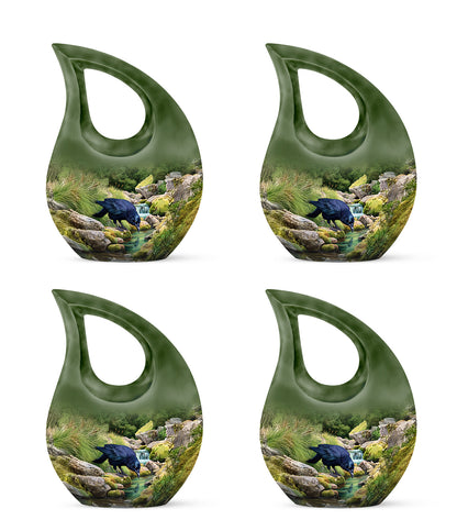 Olive Green Crow Cremation Urn lifestyle display on memorial shelf - faith-inspired cross-drop urn with crow pattern - 10 inch aluminum urn for cremated remains