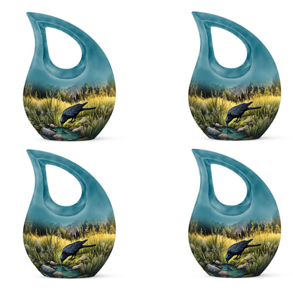 Vivid Teal Crow Cremation Urn lifestyle display on memorial shelf - devotional cross-drop crow engraving - 10 inch aluminum urn for cremated remains