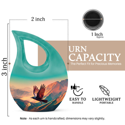 Sea Green Teal Crow Cremation Urn back view with polished surface - sacred cross merged with crow motif on metal - mini keepsake memorial for portion of cremation ashes