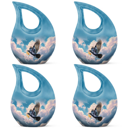 Vivid Blue Crow Cremation Urn lifestyle display on memorial shelf - devotional cross-drop crow engraving - 10 inch aluminum urn for cremated remains