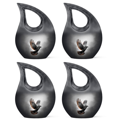 Charcoal Black Crow Cremation Urn lifestyle display on memorial shelf - devotional cross-drop crow engraving - 10 inch aluminum urn for cremated remains