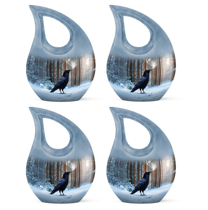Pastel Blue Crow Cremation Urn lifestyle display on memorial shelf - sacred cross merged with crow motif on metal - 10 inch aluminum urn for cremated remains