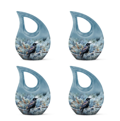 Serene Blue Crow Cremation Urn lifestyle display on memorial shelf - faith-inspired cross-drop urn with crow pattern - 10 inch aluminum urn for cremated remains