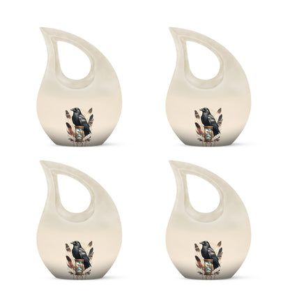 Silk White Crow Cremation Urn lifestyle display on memorial shelf - devotional cross-drop crow engraving - 10 inch aluminum urn for cremated remains
