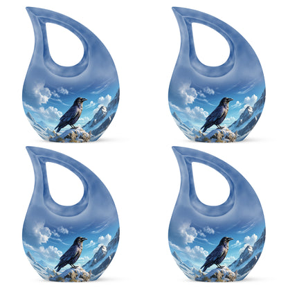 Bright Blue Crow Cremation Urn lifestyle display on memorial shelf - devotional cross-drop crow engraving - 10 inch aluminum urn for cremated remains