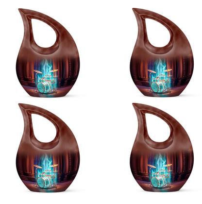 Scarlet Red Drums Cremation Urn lifestyle display on memorial shelf - faith-inspired cross-drop urn with drums pattern - 10 inch aluminum urn for cremated remains