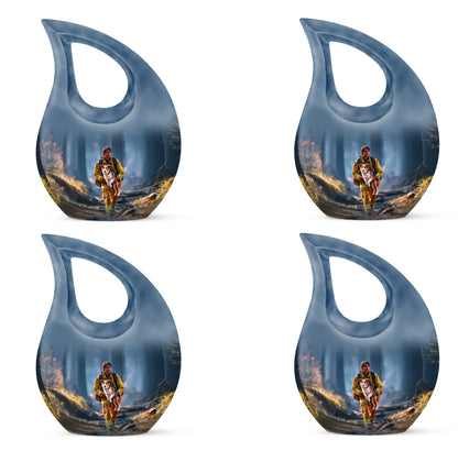 Icy Blue Firefighter Cremation Urn lifestyle display on memorial shelf - sacred cross merged with firefighter motif on metal - 10 inch aluminum urn for cremated remains