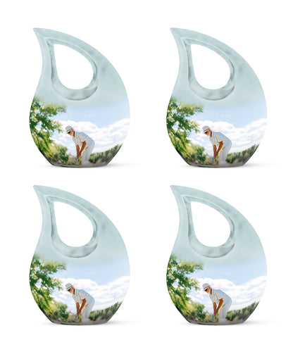 Sterling Silver Golf Cremation Urn lifestyle display on memorial shelf - sacred cross merged with golf motif on metal - 10 inch aluminum urn for cremated remains