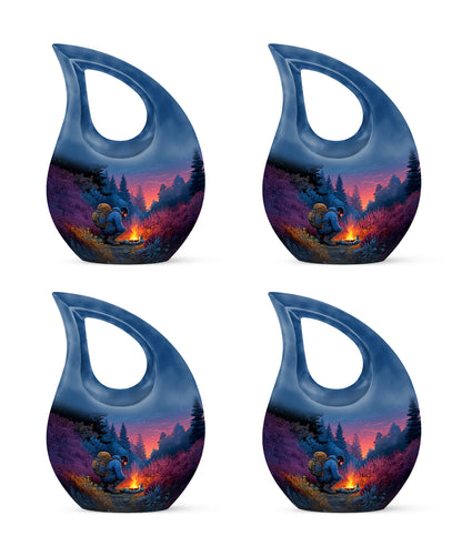 Indigo Campfire Cremation Urn lifestyle display on memorial shelf - sacred cross merged with campfire motif on metal - 10 inch aluminum urn for cremated remains