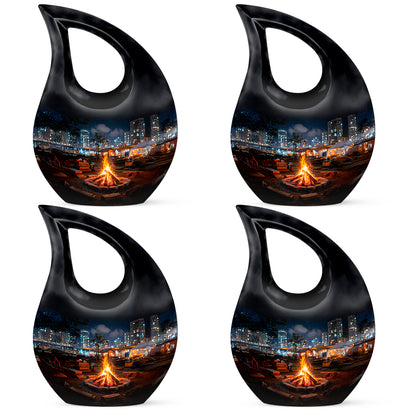 Deep Black Campfire Cremation Urn lifestyle display on memorial shelf - sacred cross merged with campfire motif on metal - 10 inch aluminum urn for cremated remains