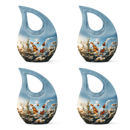 Slate Blue Daisy Cremation Urn lifestyle display on memorial shelf - sacred cross merged with daisy motif on metal - 10 inch aluminum urn for cremated remains