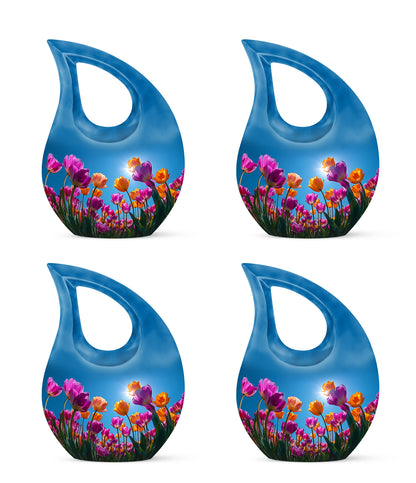 Soft Blue Garden Tulip Cremation Urn lifestyle display on memorial shelf - devotional cross-drop garden tulip engraving - 10 inch aluminum urn for cremated remains
