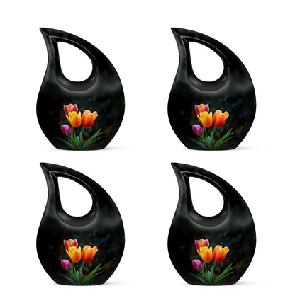 Ebony Garden Tulip Cremation Urn lifestyle display on memorial shelf - sacred cross merged with garden tulip motif on metal - 10 inch aluminum urn for cremated remains