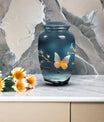 Elegant butterfly urn in metal custom designed for preserving adult female ashes, a unique and personalized tribute for mom