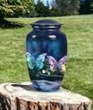 Elegant butterfly-themed funeral urn used for burial in ground, serving as a secure ash holder for human ashes