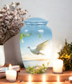 Image of dove-designed metal urn for human ashes, an elegant funerary urn suitable for adult men