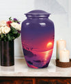 Large purple Sunset Urn of aluminium, measures 10 inches high and 7 inches in diameter with customization of engraved names. Package includes velvet pouch and handling instructions.