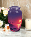 Large purple Sunset Urn of aluminium, measures 10 inches high and 7 inches in diameter with customization of engraved names. Package includes velvet pouch and handling instructions.