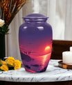 Large purple Sunset Urn of aluminium, measures 10 inches high and 7 inches in diameter with customization of engraved names. Package includes velvet pouch and handling instructions.