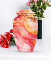 A 10 inch Vibrant Swirl memorial urn for burial, with an aluminimum finish in an abstract design