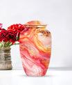 A 10 inch Vibrant Swirl memorial urn for burial, with an aluminimum finish in an abstract design