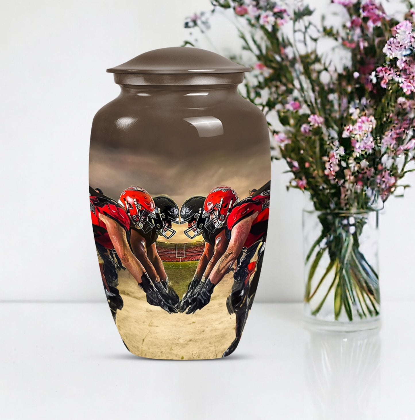 10-inch classic football urn made of aluminum for human ashes.