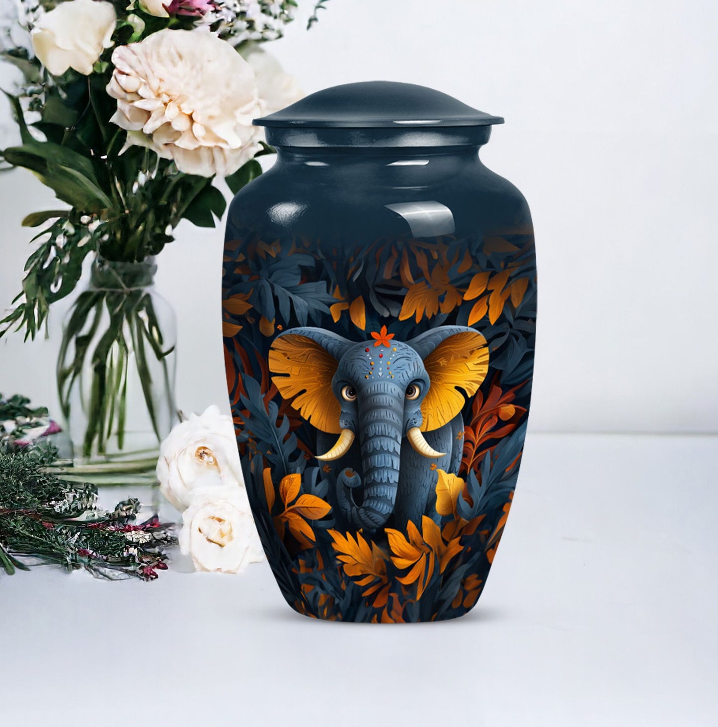 10 inch classic elephant urn with floral theme.