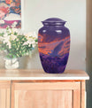 Classic 10-inch aluminum white dove on purple cremation urn.