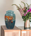 10-inch classic aluminium basketball urn, butterfly-themed.