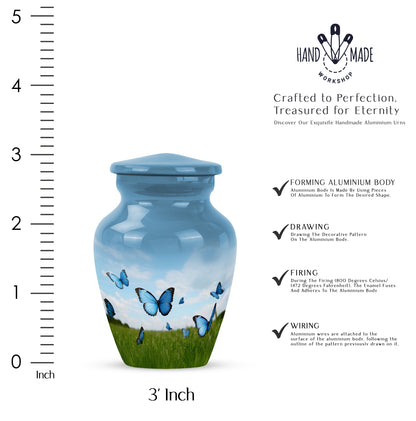 Navy Blue Butterfly Cremation Urn close-up of engraving and surface detail - classic sculpted butterfly pattern on smooth aluminum - mini keepsake memorial for portion of cremation ashes
