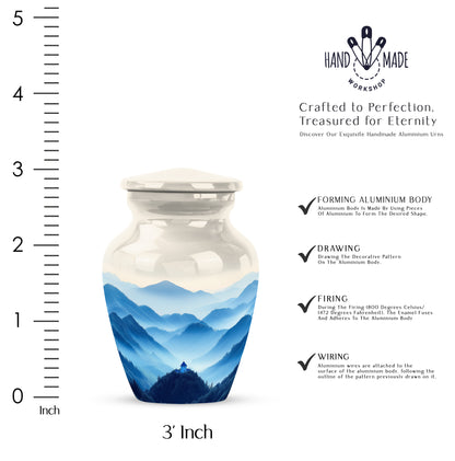 Gleaming Silver Blue Cremation Urn close-up of engraving and surface detail - classic sculpted blue pattern on smooth aluminum - mini keepsake memorial for portion of cremation ashes