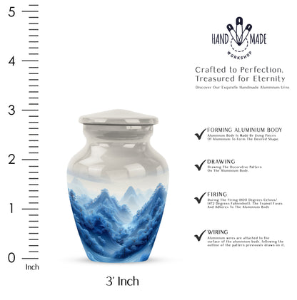 Gleaming Silver Blue Cremation Urn close-up of engraving and surface detail - classic sculpted blue pattern on smooth aluminum - mini keepsake memorial for portion of cremation ashes