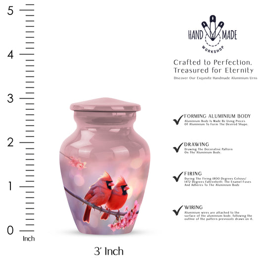 Burgundy Red Cardinal Cremation Urn close-up of engraving and surface detail - classic sculpted cardinal pattern on smooth aluminum - mini keepsake memorial for portion of cremation ashes
