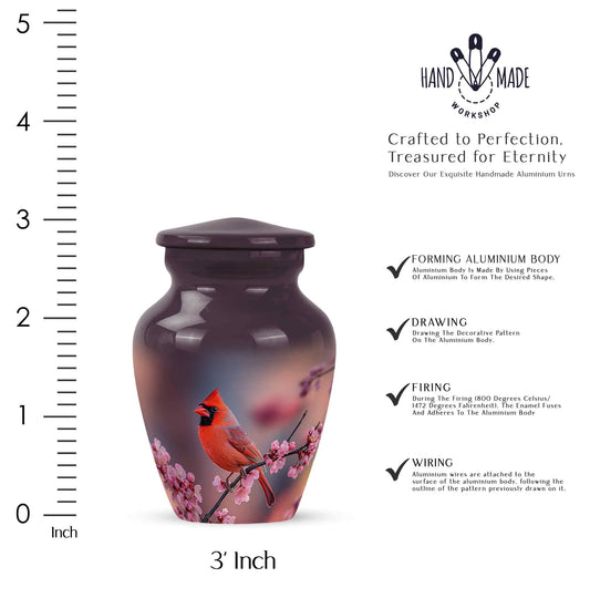 Pastel Pink Cardinal Cremation Urn close-up of engraving and surface detail - timeless cardinal motif etched into premium metal - mini keepsake memorial for portion of cremation ashes