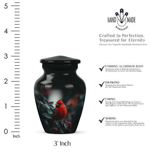 Glossy Black Cardinal Cremation Urn close-up of engraving and surface detail - classic sculpted cardinal pattern on smooth aluminum - mini keepsake memorial for portion of cremation ashes