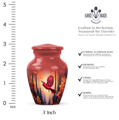 Burgundy Red Cardinal Cremation Urn close-up of engraving and surface detail - classic sculpted cardinal pattern on smooth aluminum - mini keepsake memorial for portion of cremation ashes