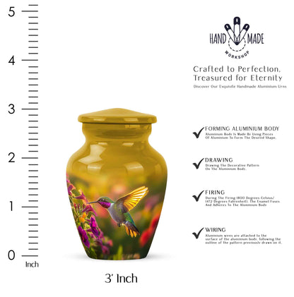 Champagne Gold Hummingbird Cremation Urn close-up of engraving and surface detail - classic sculpted hummingbird pattern on smooth aluminum - mini keepsake memorial for portion of cremation ashes