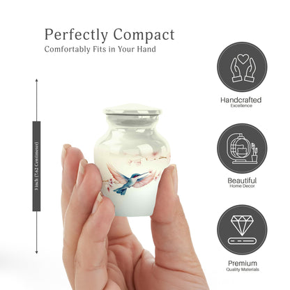 Porcelain White Hummingbird Cremation Urn close-up of engraving and surface detail - traditional hummingbird engraving with hand-polished finish - mini keepsake memorial for portion of cremation ashes