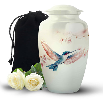 Ivory White Hummingbird Cremation Urn angled view of lid and engraved motif - classic sculpted hummingbird pattern on smooth aluminum - full-size 10 inch 200 cubic inch adult cremation urn