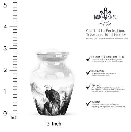 Gleaming Silver Eagle Cremation Urn close-up of engraving and surface detail - classic sculpted eagle pattern on smooth aluminum - mini keepsake memorial for portion of cremation ashes