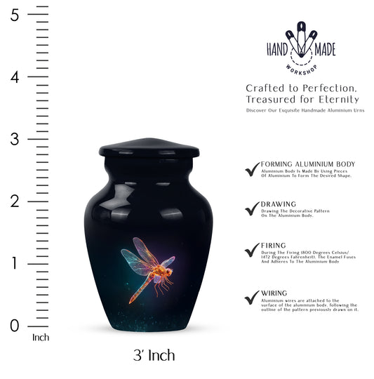 Rich Black Dragonfly Cremation Urn close-up of engraving and surface detail - classic sculpted dragonfly pattern on smooth aluminum - mini keepsake memorial for portion of cremation ashes