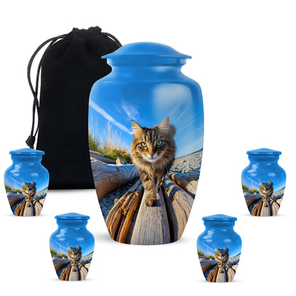 Celestial Blue Cat Cremation Urn top-down view of secure threaded lid - classic sculpted cat pattern on smooth aluminum - memorial set with one large and four small urns