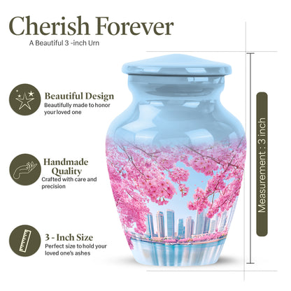Pastel Blue Cherry Blossom Cremation Urn close-up of engraving and surface detail - timeless cherry blossom motif etched into premium metal - mini keepsake memorial for portion of cremation ashes