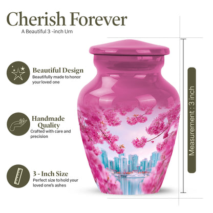 Blush Pink Cherry Blossom Cremation Urn close-up of engraving and surface detail - classic sculpted cherry blossom pattern on smooth aluminum - mini keepsake memorial for portion of cremation ashes