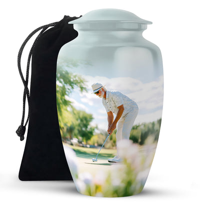 Gleaming Silver Golf Cremation Urn angled view of lid and engraved motif - classic sculpted golf pattern on smooth aluminum - full-size 10 inch 200 cubic inch adult cremation urn